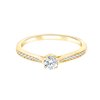 Solitaire accompagné serti clos diamant en or 18 carats
