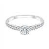 Solitaire accompagné serti clos diamant en or 18 carats