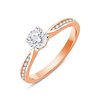 Solitaire accompagné serti clos diamant en or 18 carats