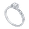 Solitaire entouré Caprice serti clos diamant et émeraude en or 18 carats