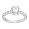 Solitaire entouré Caprice serti clos diamant et émeraude en or 18 carats